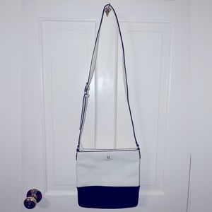 Kate Spade adjustable strap cross body purse. Lightly worn. Black and white.